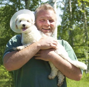 Field Maloney and West County Cider attack dog Snowball Jr. at the birch grove on the edge of the Catamount Hill Orchard, Colrain, MA. ABE LOOMIS 